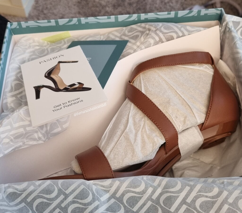Pashion walnut sandals in the shipping box